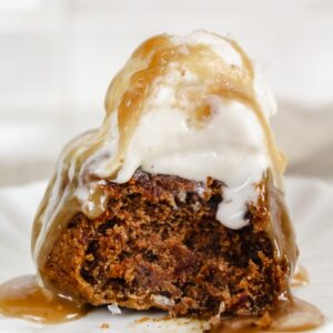 side view of healthy sticky toffee pudding with bite taken out of it