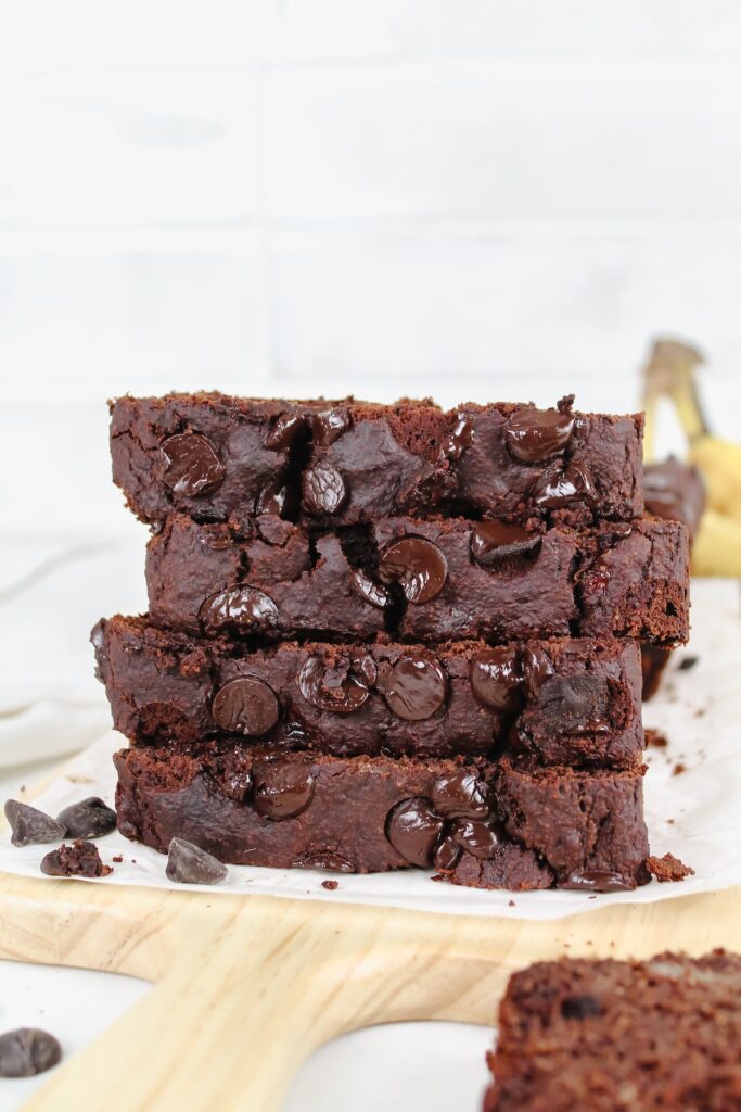 double chocolate protein banana bread slices stacked on top of each other