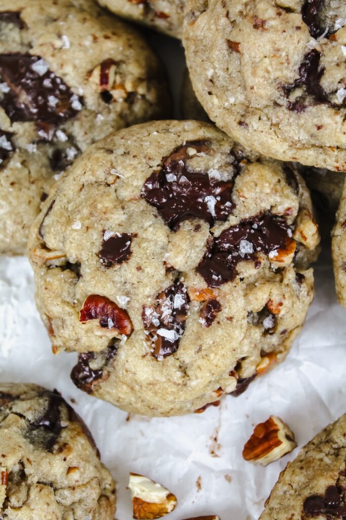 close up shot of a coconut pecan chocolate chip cookie