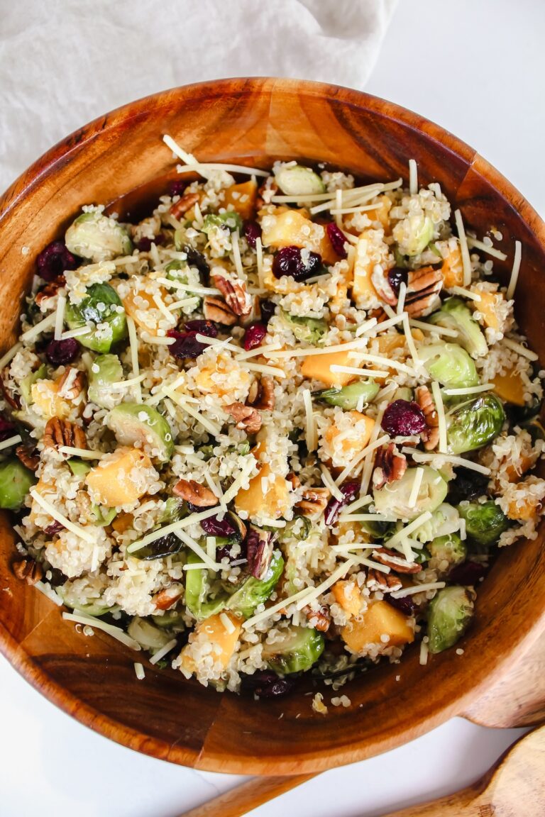 overview shot of roasted brussels sprouts and butternut squash quinoa salad in a wooden bowl