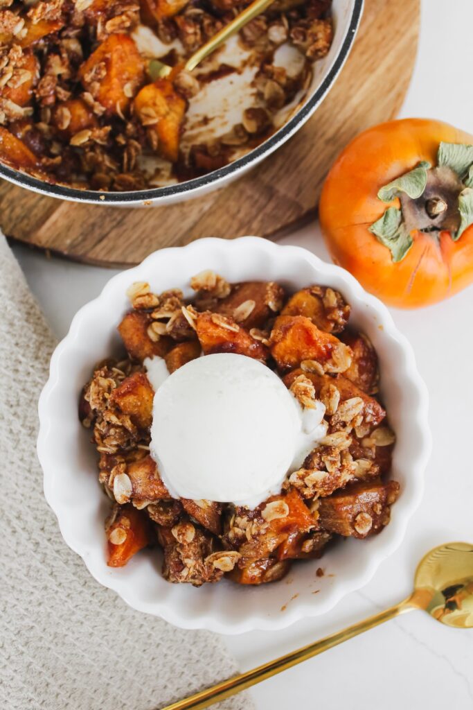 white bowl with persimmon crisp