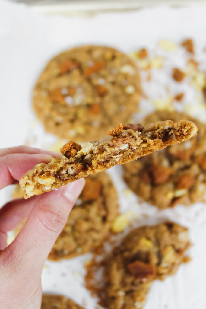 hand holding a half cookie