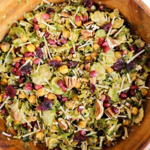 overview shot of wooden bowl with roasted shredded brussels sprouts and chickpea salad