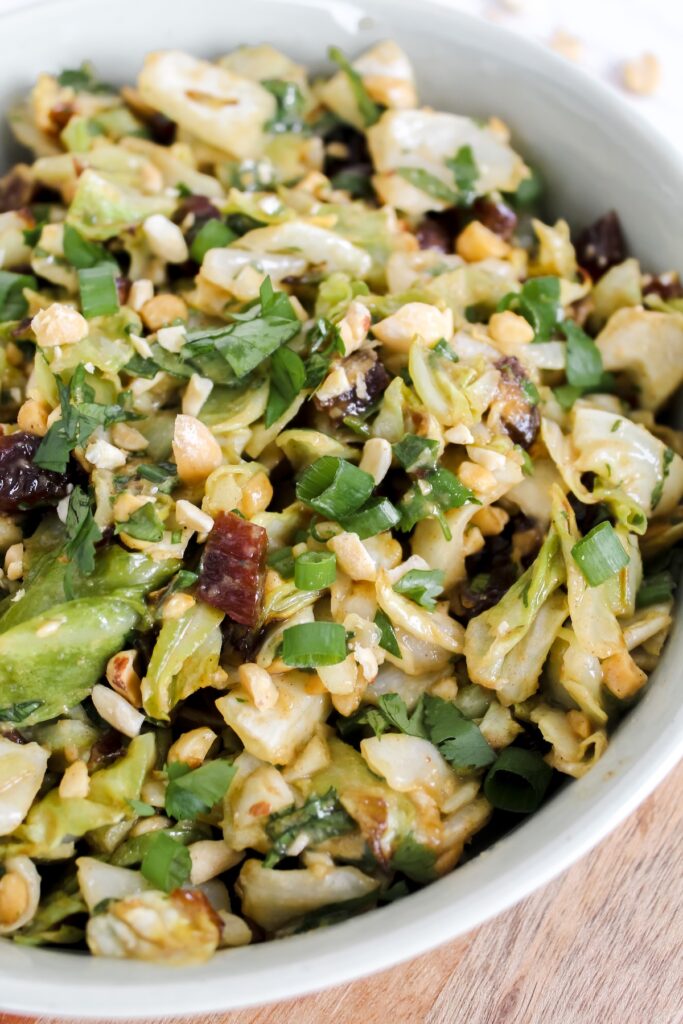 angled shot of roasted cabbage peanut date salad