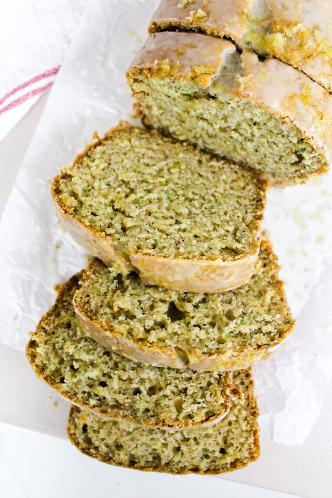 overview shot of slices of vegan lemon zucchini bread laid out