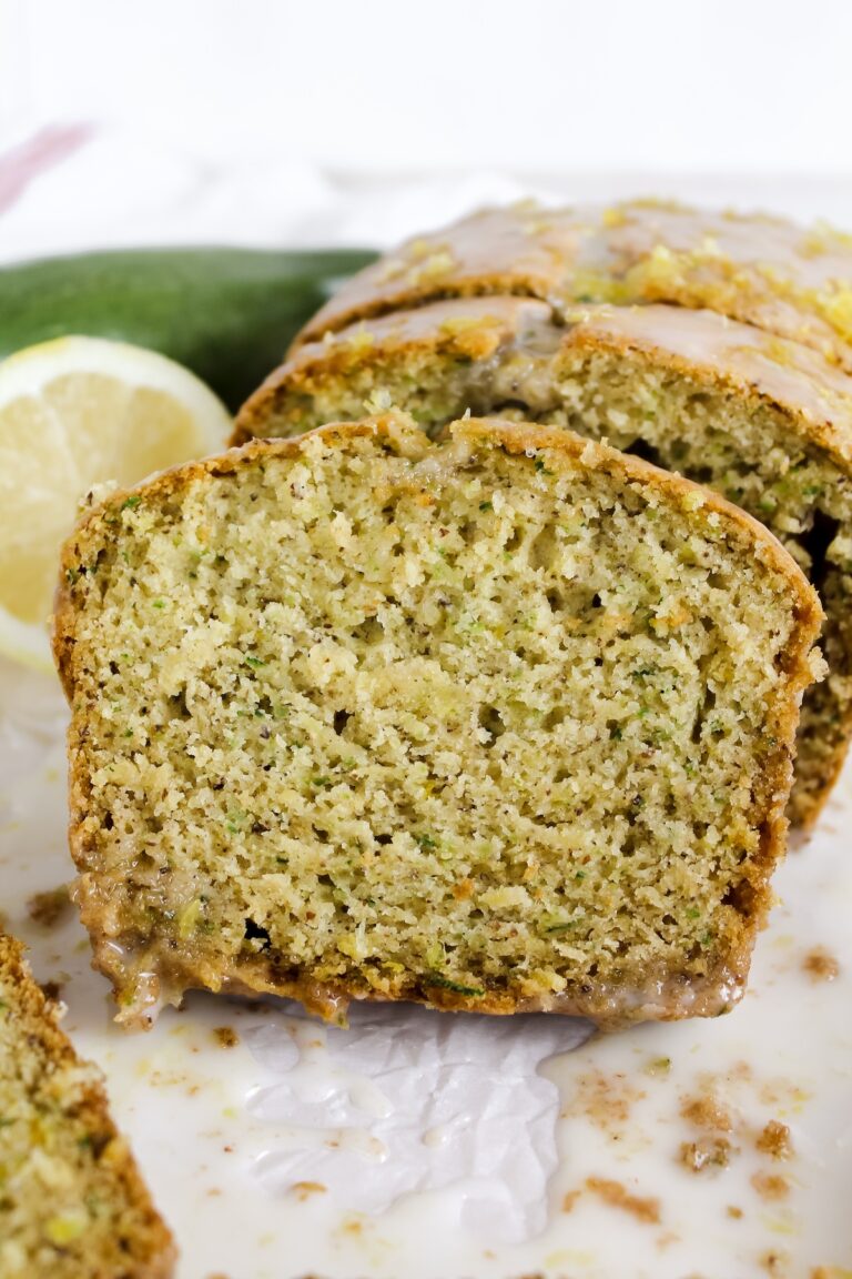 close up shot of a slice of lemon zucchini bread