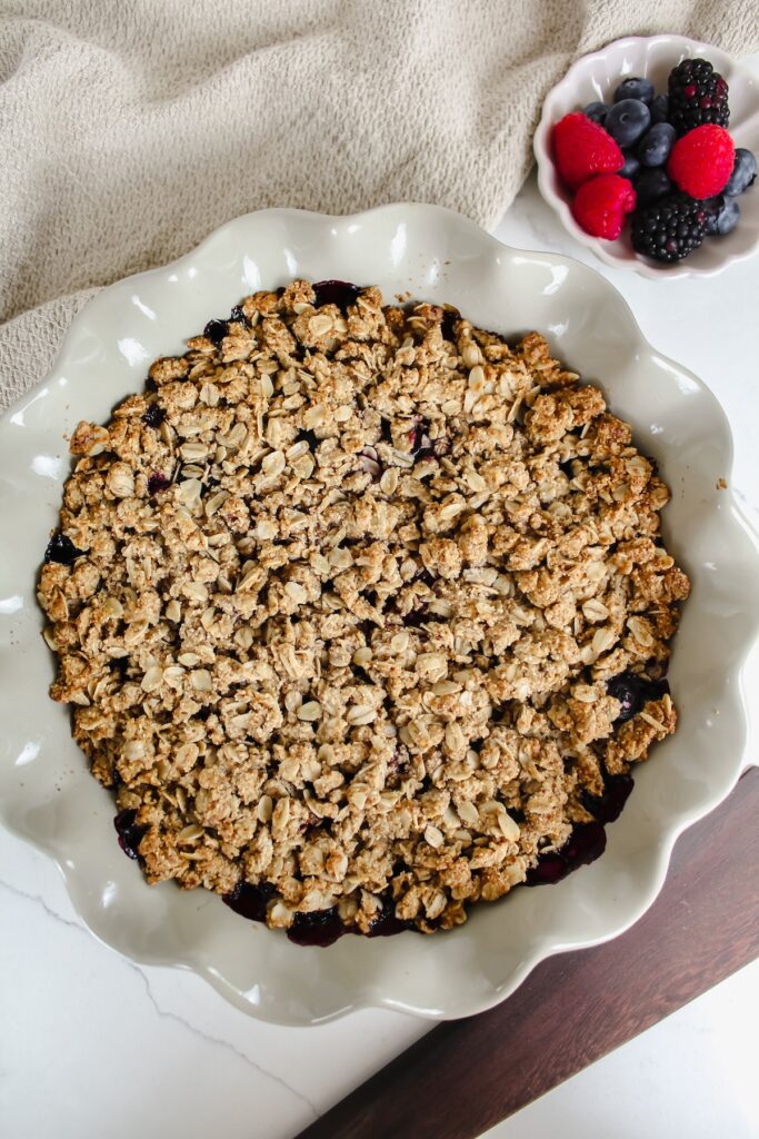 overview shot of the entire dish of healthy triple berry crisp