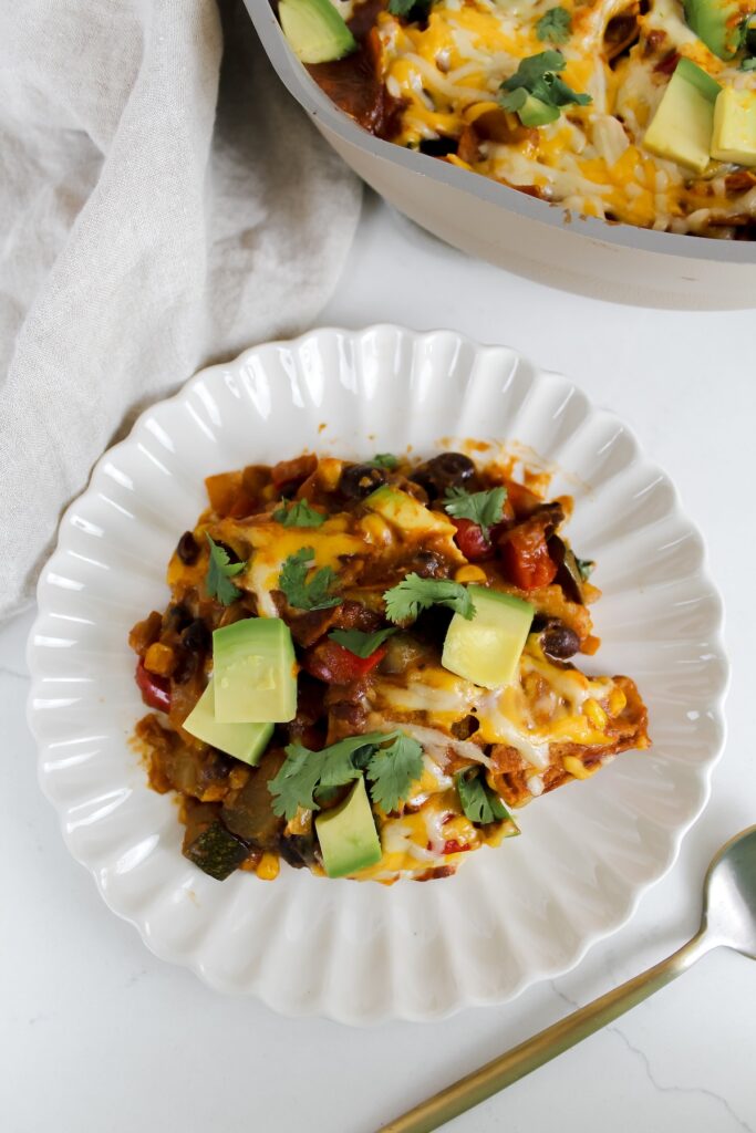 overview shot of enchiladas on a white plate