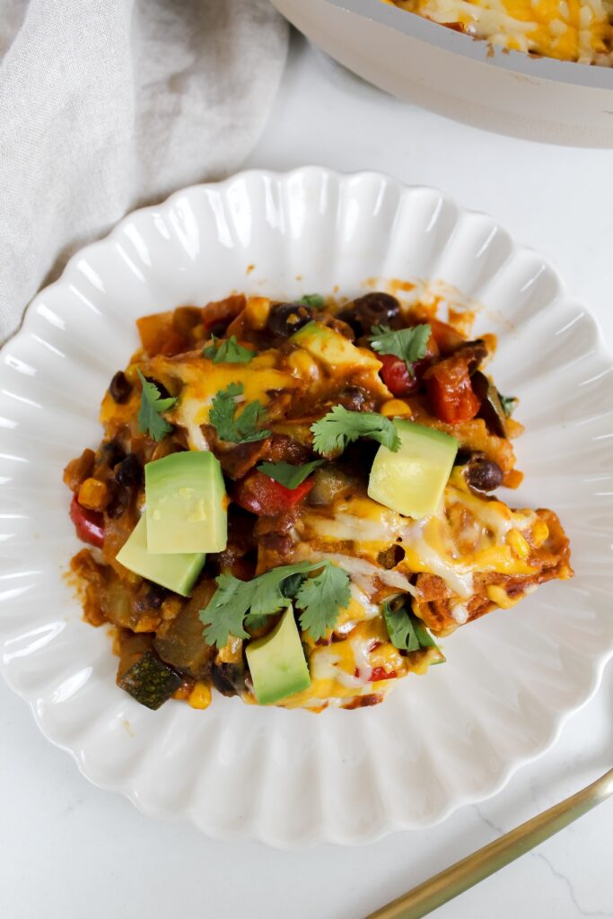 close up shot of enchiladas on a white plate