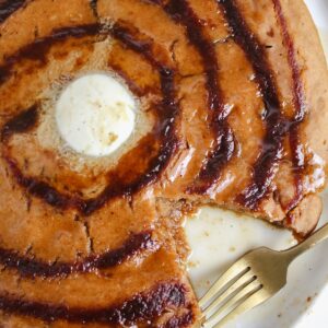 bite taken out of giant pumpkin cinnamon roll pancake