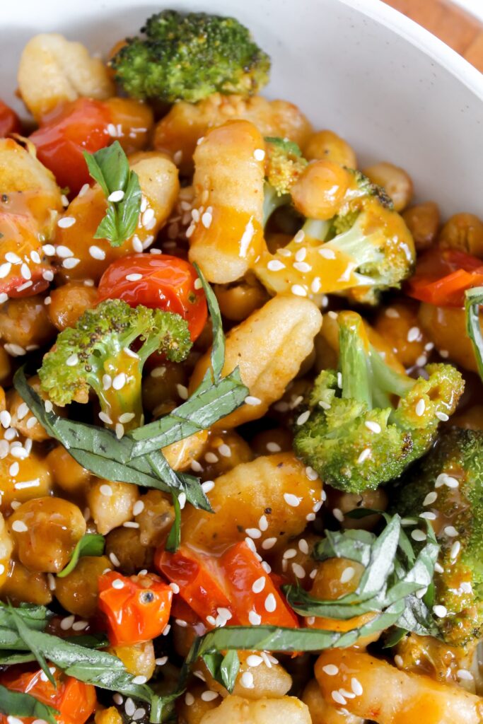 close up shot of gnocchi and veggies